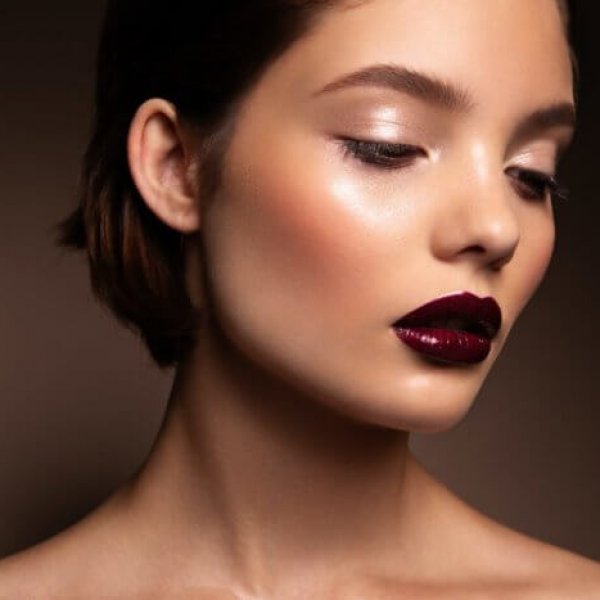 Close-up portrait of beautiful woman with bright make-up
